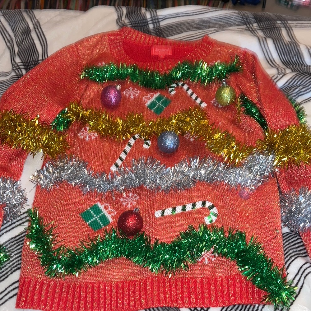 Christmas sweater a few garland’s off a little bit but fixable size: medium